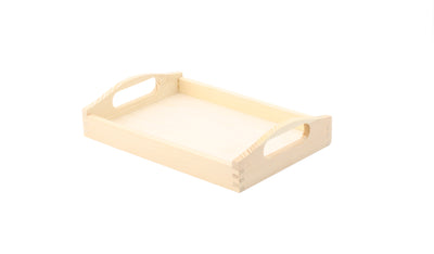 A rectangular wooden tray with cut out handles on a white background